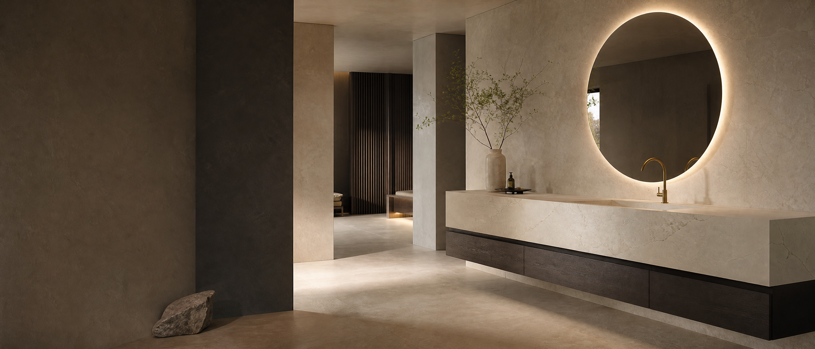 Suíte contemporânea com bancada em porcelanato, espelho orgânico e iluminação indireta